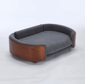 An American-style elevated dog bed pet sofa featuring solid wood legs, a curved wooden backrest, and a deep gray velvet seat cushion. This large- (W794125953: W794125953)